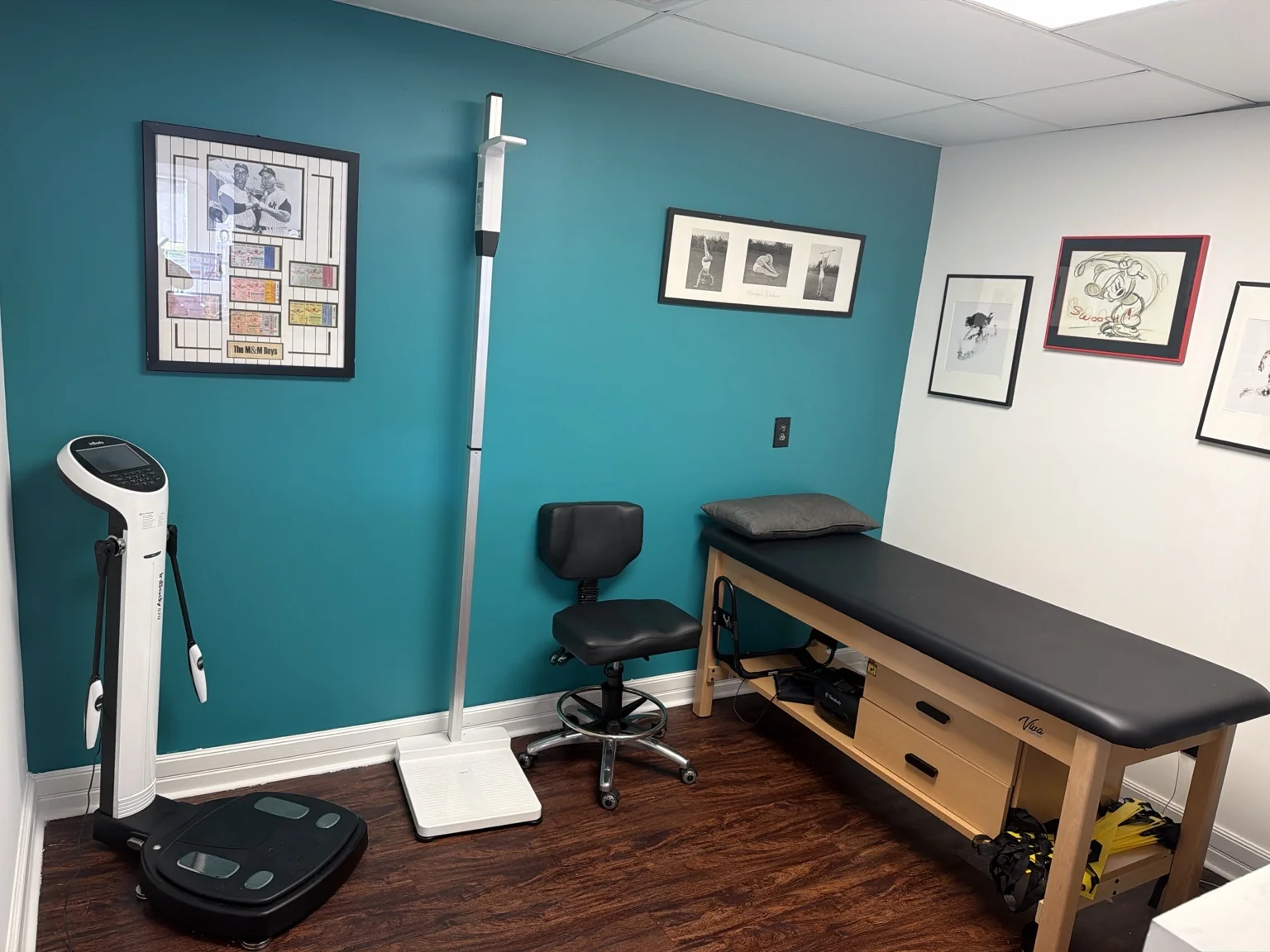 InBody body-composition analyzer, scale, stool, and assessment table in the evaluation room.